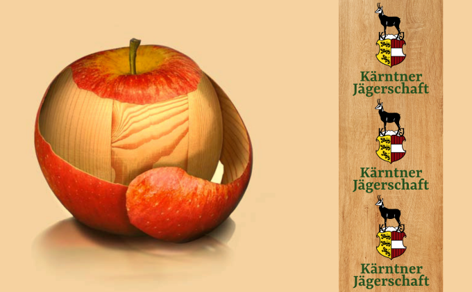 Apfel mit Holzstruktur und drei Kärntner Jägerschaft Logos